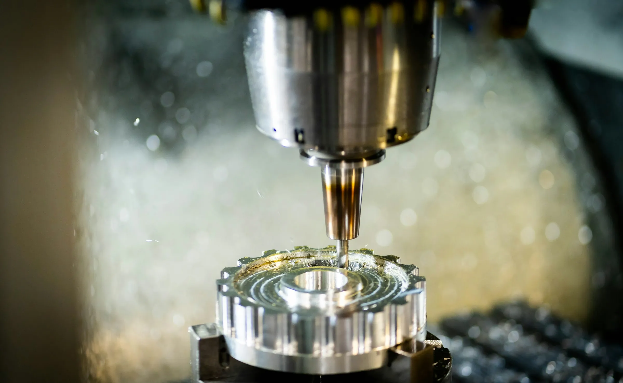 Machine spindle and cutting tool over a metal workpiece